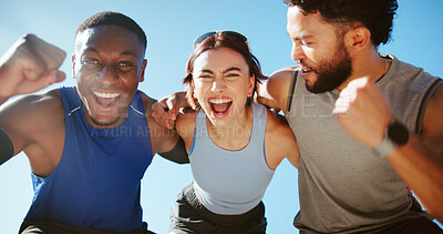 Buy stock photo Happy people, fitness and hug with fist pump for winning, success or health and wellness together. Active, group or excited friends with smile for workout, teamwork or exercise achievement in nature