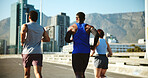 People, back and running in city with exercise for workout, fitness or training on road. Active group, friends or runners with bridge for sport, marathon or outdoor sprint together in an urban town