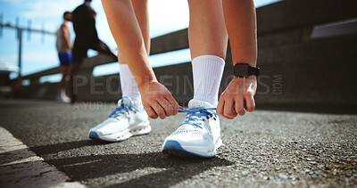 Buy stock photo Fitness, hands and tie shoes in city to start workout, training or exercise for practice on road. Street, person and runner tying laces on sneakers for sports, preparation and ready for challenge