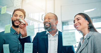 Buy stock photo Writing, ideas and business people at glass with collaboration, sticky note and brainstorming in office. Teamwork, problem solving and planning with moodboard for growth, development and discussion