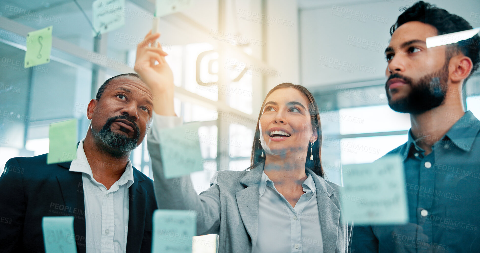 Buy stock photo Teamwork, writing and business people at glass with collaboration, sticky note or brainstorming in office. Strategy, problem solving and planning with moodboard for growth, development and discussion