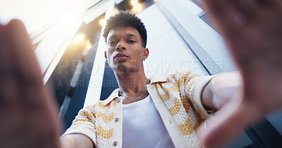 Buy stock photo Fashion, frame and portrait of man in city with confidence for style, trendy and outfit. Low angle, perspective and selfie of person in urban town for creative, aesthetic and picture for photography