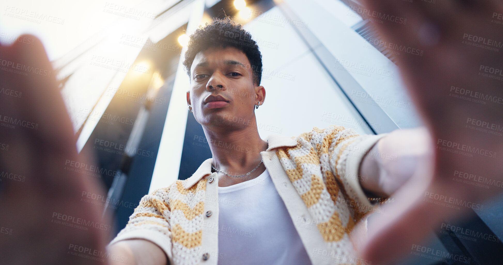 Buy stock photo Fashion, frame and portrait of man in city with confidence for style, trendy and outfit. Low angle, perspective and selfie of person in urban town for creative, aesthetic and picture for photography