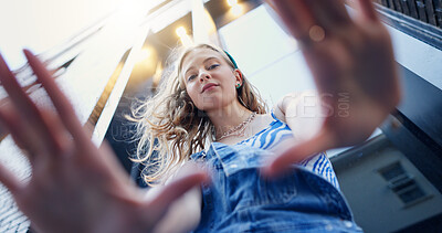 Buy stock photo Below, hand frame and portrait of girl in city with confidence for style, trendy or outfit. Low angle, perspective and selfie of person in town for fashion, aesthetic and picture for photography