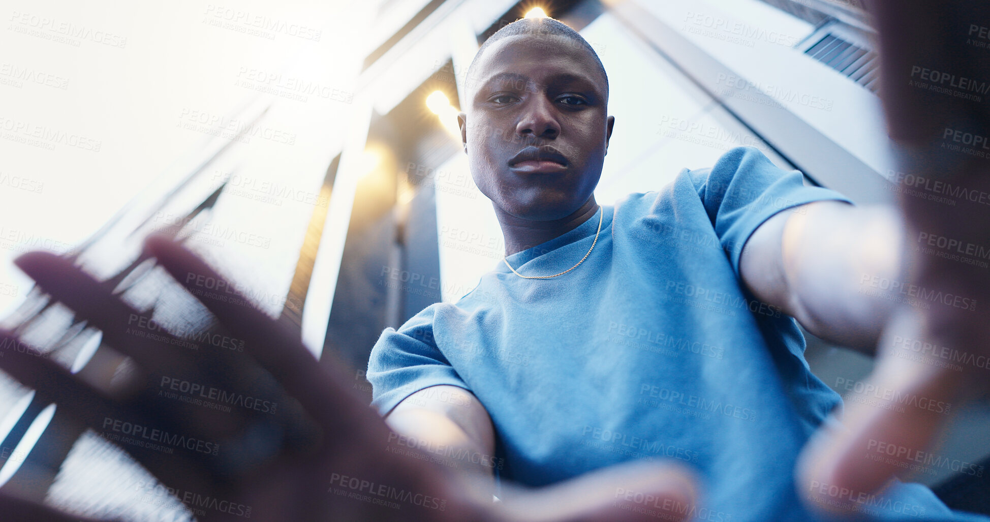 Buy stock photo Below, hand frame and portrait of man in city with confidence for style, trendy or outfit. Low angle, perspective and selfie of person in urban town for fashion, aesthetic and picture for photography