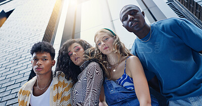 Buy stock photo Below, fashion and portrait of friends in city with confidence for style, trendy clothes and outfit. Low angle, creative and men and women in urban town for perspective, aesthetic and photography