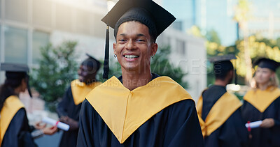 Buy stock photo Happy, man and portrait of graduate in city for education goal, qualification or achievement. Smile, outdoor and male university student with pride for college degree with learning at campus in town.