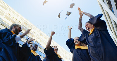 Buy stock photo Graduates, throw and hats for graduation success, education achievement or diploma goals. City, excited people or academic cap in air for celebration, low angle or learning with university target