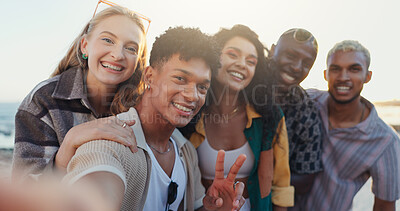Buy stock photo Friends, happy and selfie with peace sign at beach for social media post, bonding memory and profile picture update. Diversity, group and photography on holiday adventure with support or summer break