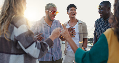 Buy stock photo Happy people, friends and beach with social for outdoor party, celebration or new year on promenade. Group, community or smile with sparkler in sunset for holiday get together or weekend by ocean