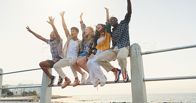Buy stock photo Friends, holiday and freedom with shouting by beach for travel adventure, summer break or bonding. Low angle, promenade and people with celebration for vacation destination, weekend trip or diversity