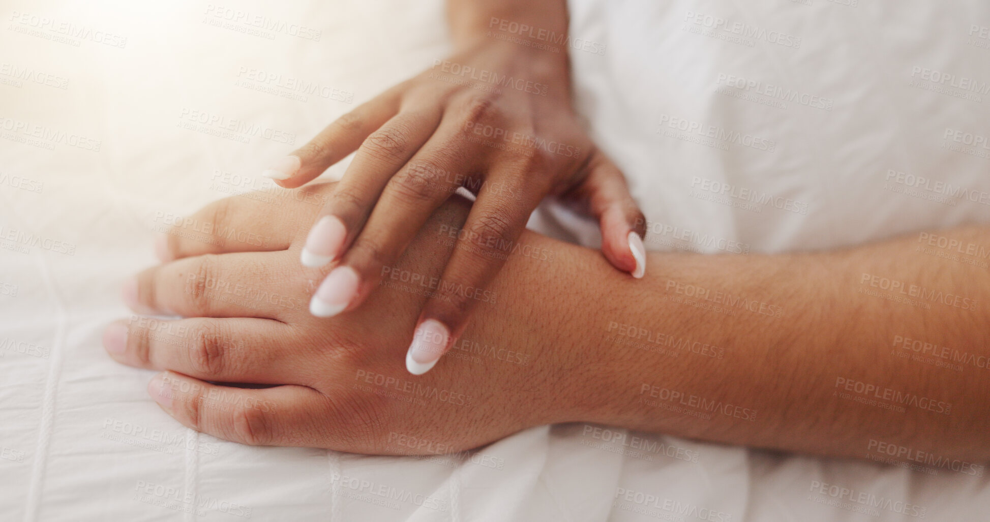 Buy stock photo Hands, touch and couple relax on bed for intimacy, partner affection and connection in morning. Closeup, people and holding with cuddle for care, romance and bonding for marriage commitment at house