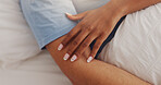 Hands, touch and couple rest on bed for intimacy, partner affection and connection in morning. Closeup, people and sleeping with embrace for care, romance and bonding for marriage commitment at house