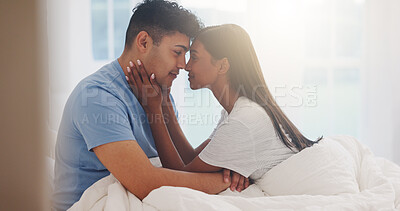 Buy stock photo Couple, forehead and love in bed together, affection and bonding with commitment for trust at home. Romance, partner and security in healthy relationship with calm and interracial people in bedroom