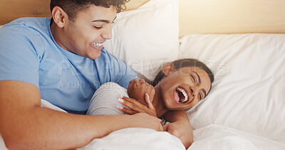 Buy stock photo Love, tickle and couple laughing in bed together for morning affection, bonding or wake up. Excited, cuddle or joke with man and happy woman in apartment for funny humor, marriage or relationship