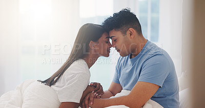 Buy stock photo Couple, forehead and love in bedroom together, affection and bonding with commitment for trust at home. Romance, partner and security in healthy relationship with calm and interracial people in bed