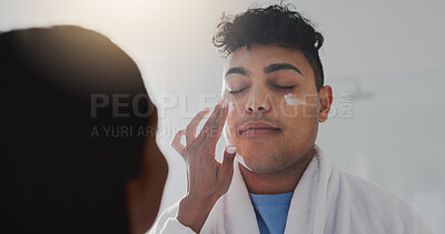 Buy stock photo Couple, lotion and man with skincare in bathroom for beauty, facial treatment and bonding together. People, help and moisturizer with sunscreen, collagen cosmetics and romance for dermatology at home