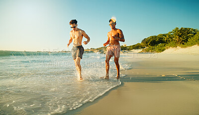 Buy stock photo Running, beach and men with vacation, friends and bonding together with tropical island. Traveller, ocean and people with cardio, shoreline and summer holiday with weekend break, energy and Zanzibar
