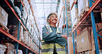 Warehouse, confidence and woman in logistics inventory with boxes, arms crossed and stock management. Low angle, smile and mature worker in cargo storage, global export and supply chain distribution