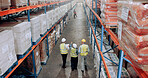 Management, warehouse and team walking for logistics, stock inventory or inspection by shelves. Above industrial employees, back of people and supply chain with safety, depot or wholesale storage