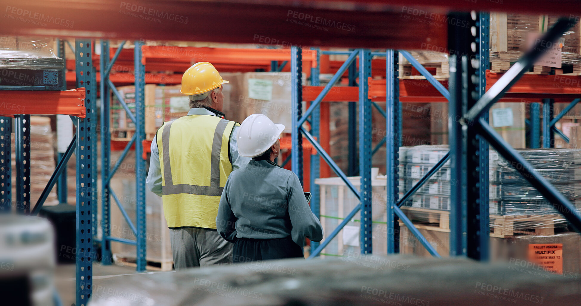 Buy stock photo Distribution, man and woman walking in warehouse for logistics, stock inventory or inspection by shelves. Industrial employees, wholesale and back of people for shipping cargo, storage or factory