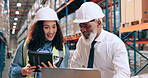 Man, woman and tablet at warehouse with laptop, logistics or discussion for supply chain management. People, mentor and happy with review, stats or planning for inventory at industrial storage plant