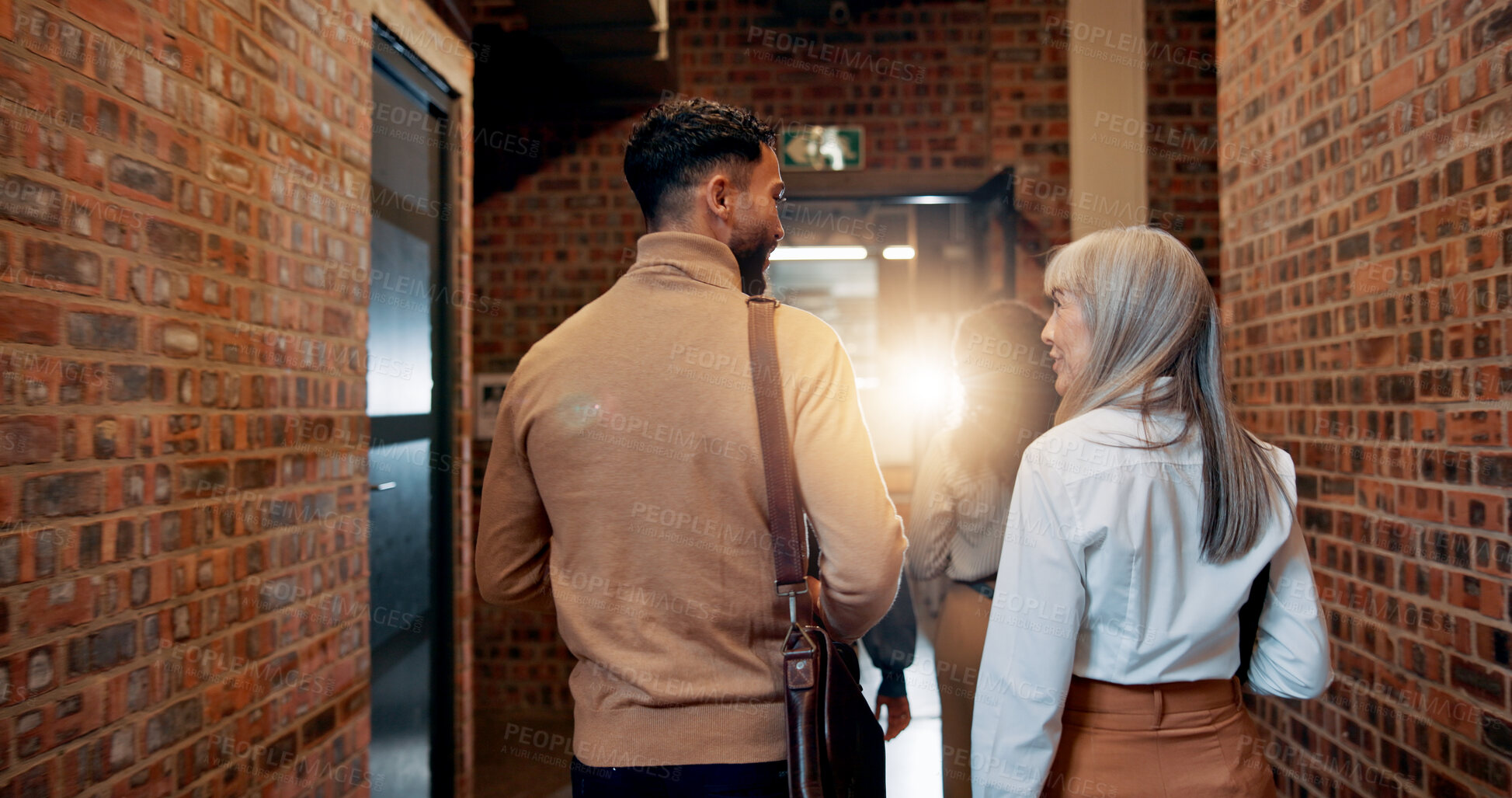 Buy stock photo Walking, back and teamwork with business people in office for partnership, discussion and support. Advice, communication and feedback with employees in agency for coworking and commitment together