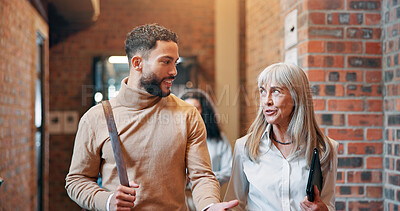 Buy stock photo Walking, talk and teamwork with business people in office for partnership, discussion and support. Advice, communication and feedback with employees in agency for coworking and commitment together