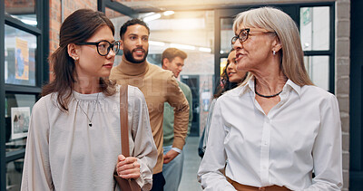 Buy stock photo Walking, talking and business people in office hallway for meeting, discussion and planning. Creative startup, professional and manager with workers speaking for teamwork, collaboration and project
