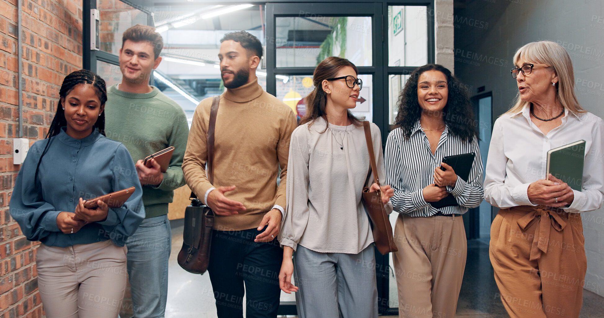 Buy stock photo Walking, team and business people in office hallway for meeting, talking and planning. Creative startup, professional and manager with workers speaking for coworking, collaboration and discussion