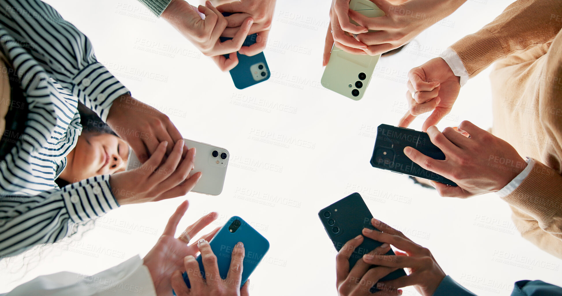 Buy stock photo Community, phone and below with hands of business people for connection, teamwork and share post link. Networking, low angle and coworking with group of employees for communication and synergy