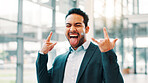 Businessman, rock sign and celebration at office with tongue out, success and portrait at corporate job. Person, happy and symbol with shouting, cheers and excited for goals at financial agency