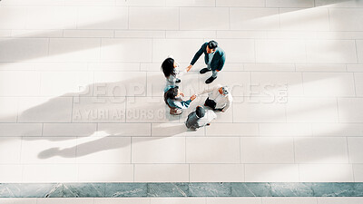 Buy stock photo Handshake, greeting and business people in office from top view for introduction, welcome or agreement. Collaboration, partnership and financial managers with stakeholder for investment deal together