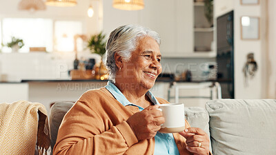 Buy stock photo Elderly woman, thinking and smile with tea for relax, nostalgia and happy memories in home. Senior person, peace and warm drink on living room sofa with reflection, wellness and comfort in retirement