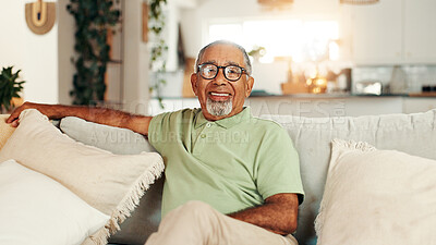 Buy stock photo Happy, relax and portrait of senior man on sofa in home with calm, peace and retirement. Smile, glasses and elderly male person from Brazil in living room with health and wellness in apartment.