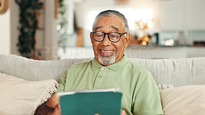 Buy stock photo Home, tablet and senior man on sofa, relax and social media  with retirement, break and smile in lounge. Online joke, pensioner and elderly person on couch, tech or internet with entertainment or app