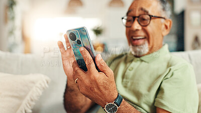 Buy stock photo Home, relax and senior man with smartphone, laughing and texting with tech in living room, smile and online. Communication, retirement and elderly person with mobile for chat, message or social media