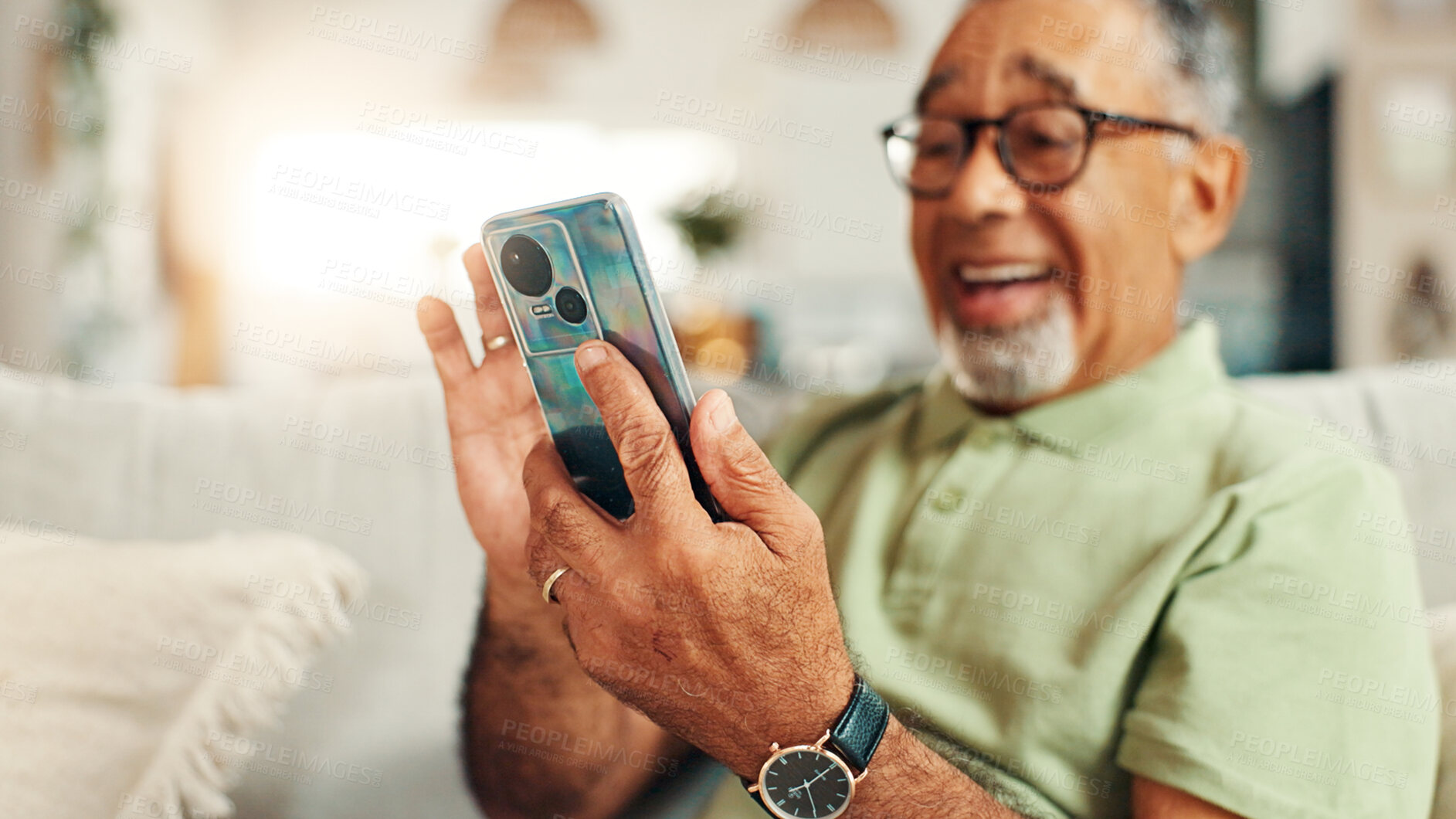 Buy stock photo Home, relax and senior man with smartphone, laughing and texting with tech in living room, smile and online. Communication, retirement and elderly person with mobile for chat, message or social media