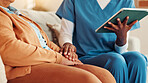 Nurse, holding hands and tablet on sofa, retirement and report for medical results, feedback or support for bad news. Caregiver, elderly person and digital touchscreen on app for consulting in home