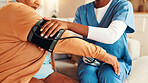 Mature woman, nursing home and blood pressure check with nurse, medical care and health exam on arm. Living room, diagnosis and conversation with healthcare, wellness support and monitoring or test