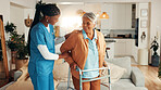 Nurse, senior woman and home with walker, happy or support for recovery with injury in living room. Caregiver, frame and elderly patient with disability with talk, smile and rehabilitation in lounge