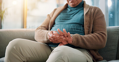 Buy stock photo Hands, home and old man on sofa, hand pain and osteoporosis with arthritis in living room. Muscle tension, pensioner and elderly person on couch, inflammation and parkinson disease with fibromyalgia