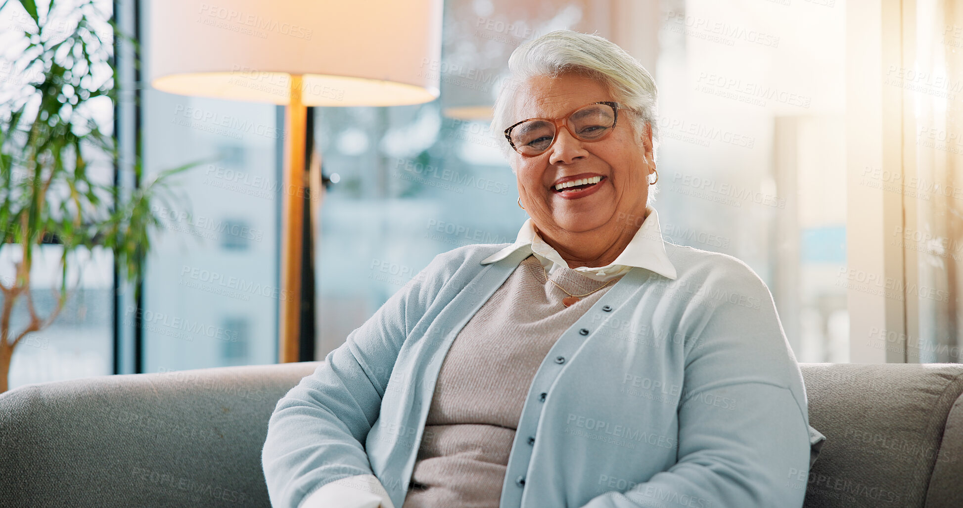 Buy stock photo Elderly woman, smile and portrait on sofa for relax, comfort and glasses in retirement. Senior person, wellness and laugh in home living room with prescription eyewear, pensioner and happy for vision