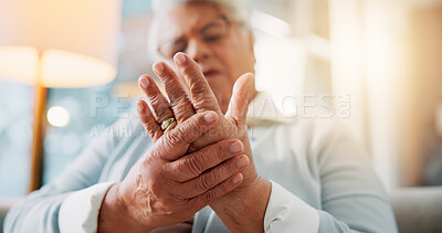 Buy stock photo Hands, home and old woman on sofa, pain and inflammation with joint injury in living room. Muscle tension, pensioner and elderly person with osteoporosis, parkinson disease and fibromyalgia.