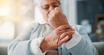 Buy stock photo Hands, home and old woman with wrist pain, tension and inflammation with arthritis in lounge. Muscle strain, pensioner or senior person with osteoporosis, fibromyalgia and parkinson disease with ache