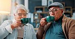 Home, senior couple and drinking coffee for relax, morning beverage and enjoy espresso. Old man, woman in tea cup in living room for retirement, latte and bonding together with caffeine in house