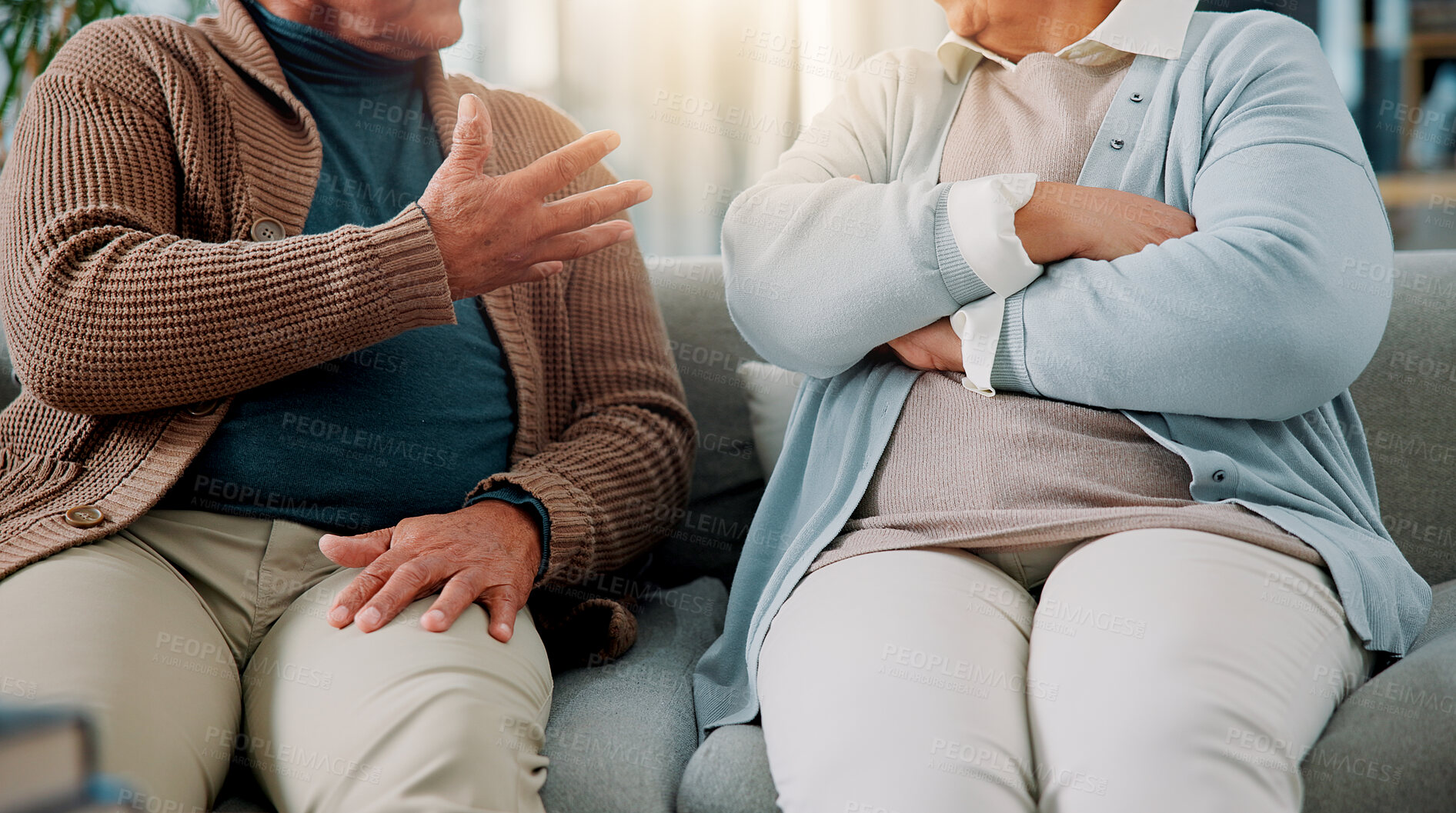 Buy stock photo Hands, couple and argument on sofa at house for fighting, divorce conflict and partner disagreement. Elderly people, communication problem and anger for separation, marriage crisis and betrayal drama