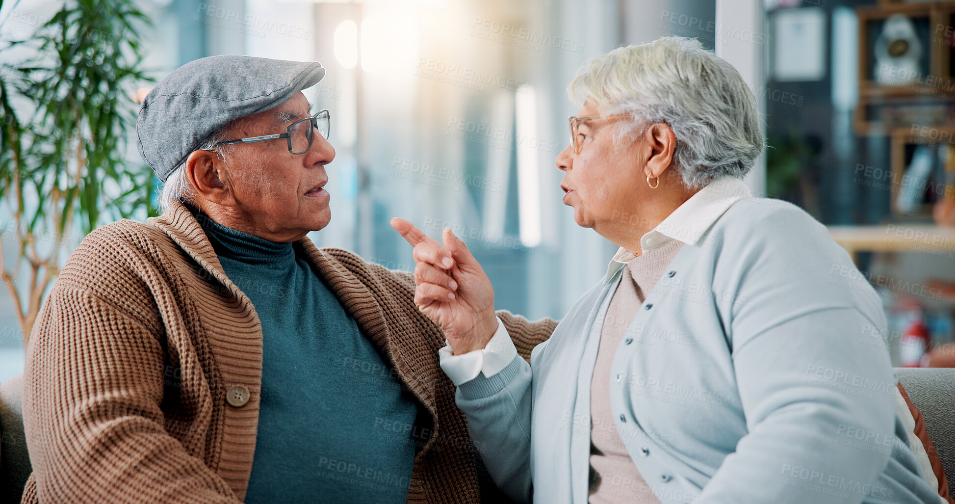 Buy stock photo Elderly couple, argument and sofa at house for fighting, divorce conflict and partner disagreement. Senior people, communication problem and opinion on separation, marriage crisis and betrayal drama