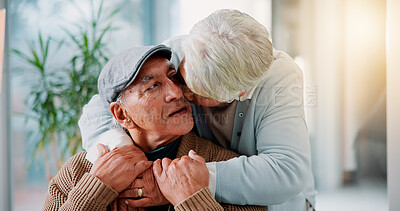 Buy stock photo Senior couple, kiss and hug in home with love, bonding and healthy relationship in retirement. Elderly man, mature wife and embrace in living room with commitment, loyalty and support in marriage
