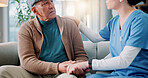 Sofa, old man and nurse with holding hands for empathy, emotional support and discussion for diagnosis. Home, senior patient and caregiver with compassion for medical condition, hope and conversation